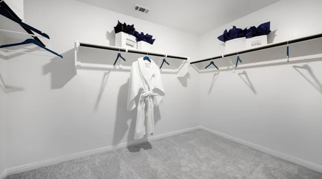 a bathroom with a sink mirror and vanity