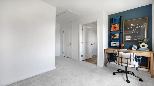 a bed room with a bed and a lamp