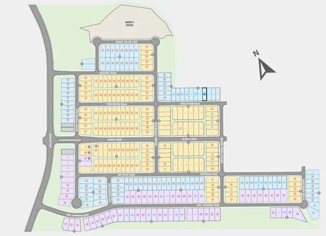 an aerial view of a swimming pool with a yard and outdoor seating
