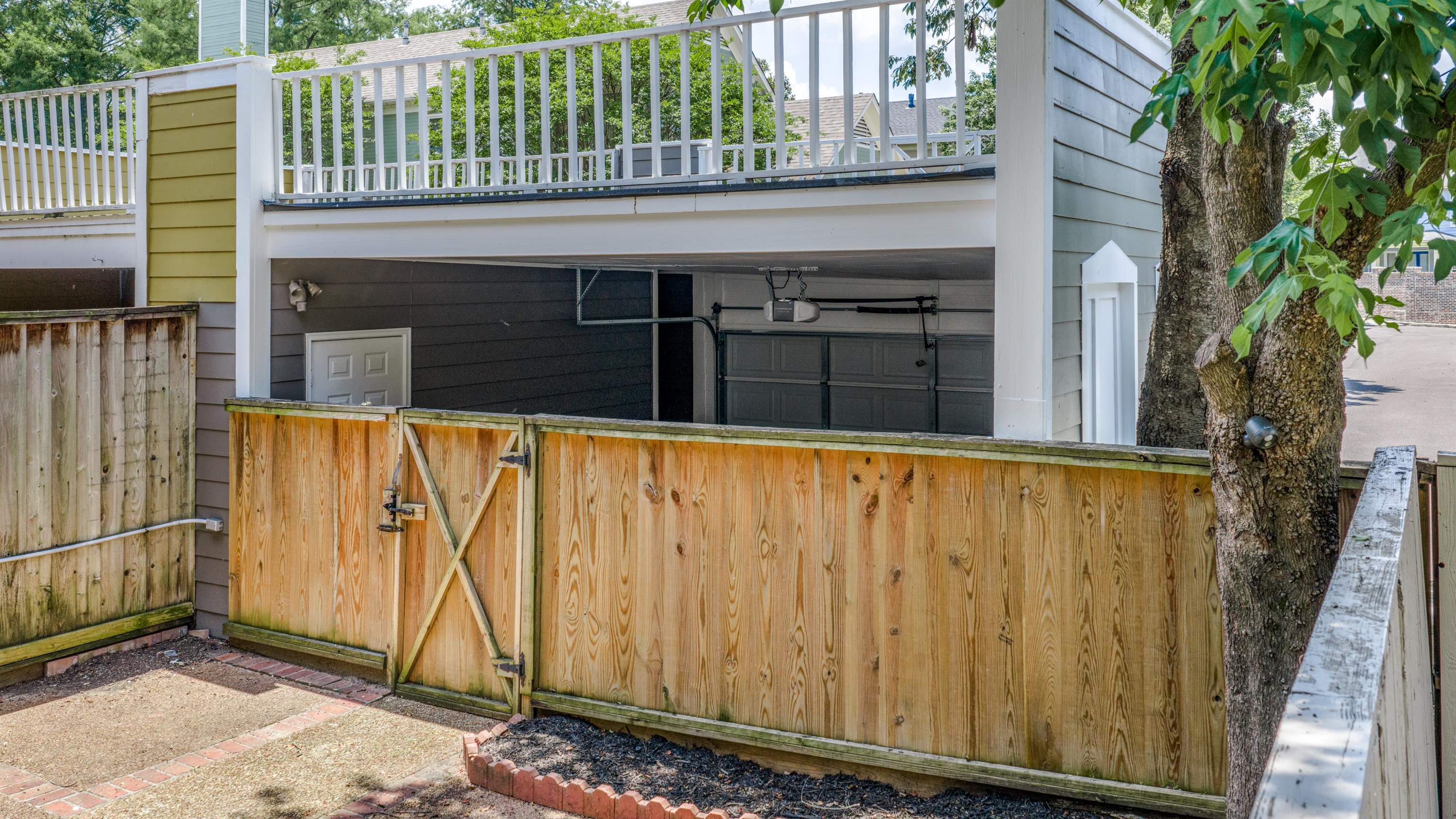 921 Harbor View Drive Memphis, TN 38103 - Photo 32 of 33 Private backyard space featuring a wood fence with gate access