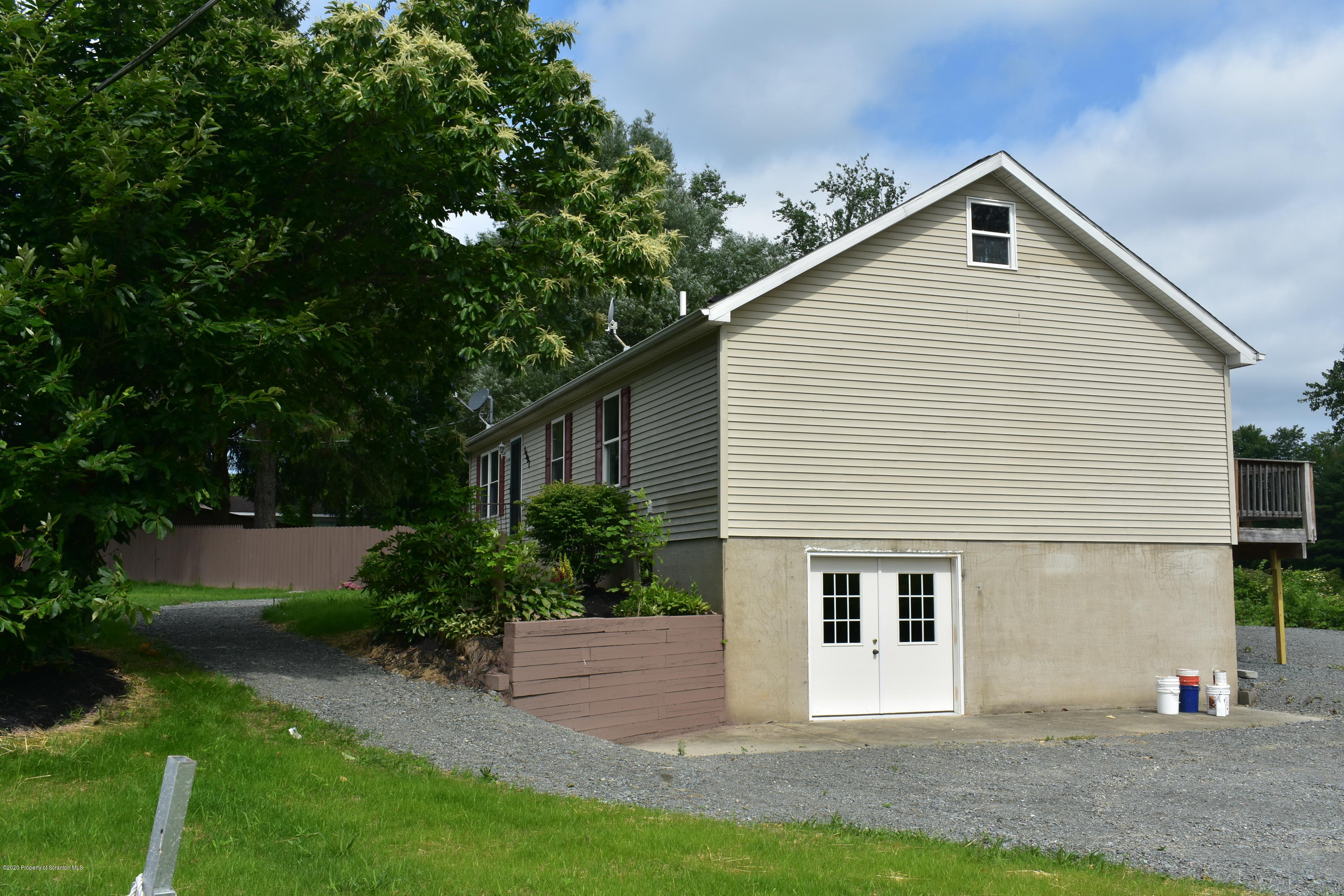 1597 Mt Cobb Road Lake Ariel, PA 18436 - Photo 19 of 28 a front view of a house with a yard