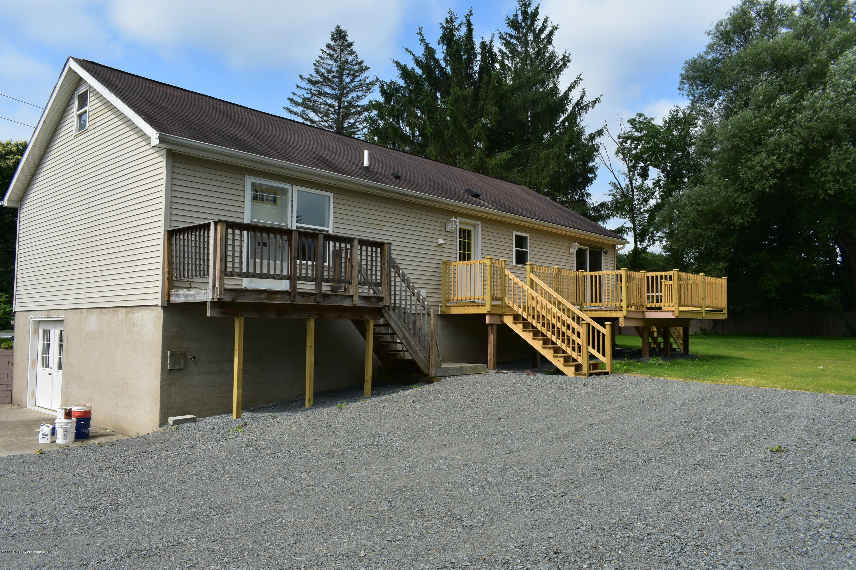 1597 Mt Cobb Road Lake Ariel, PA 18436 - Photo 21 of 28 a view of a house with a yard and sitting area