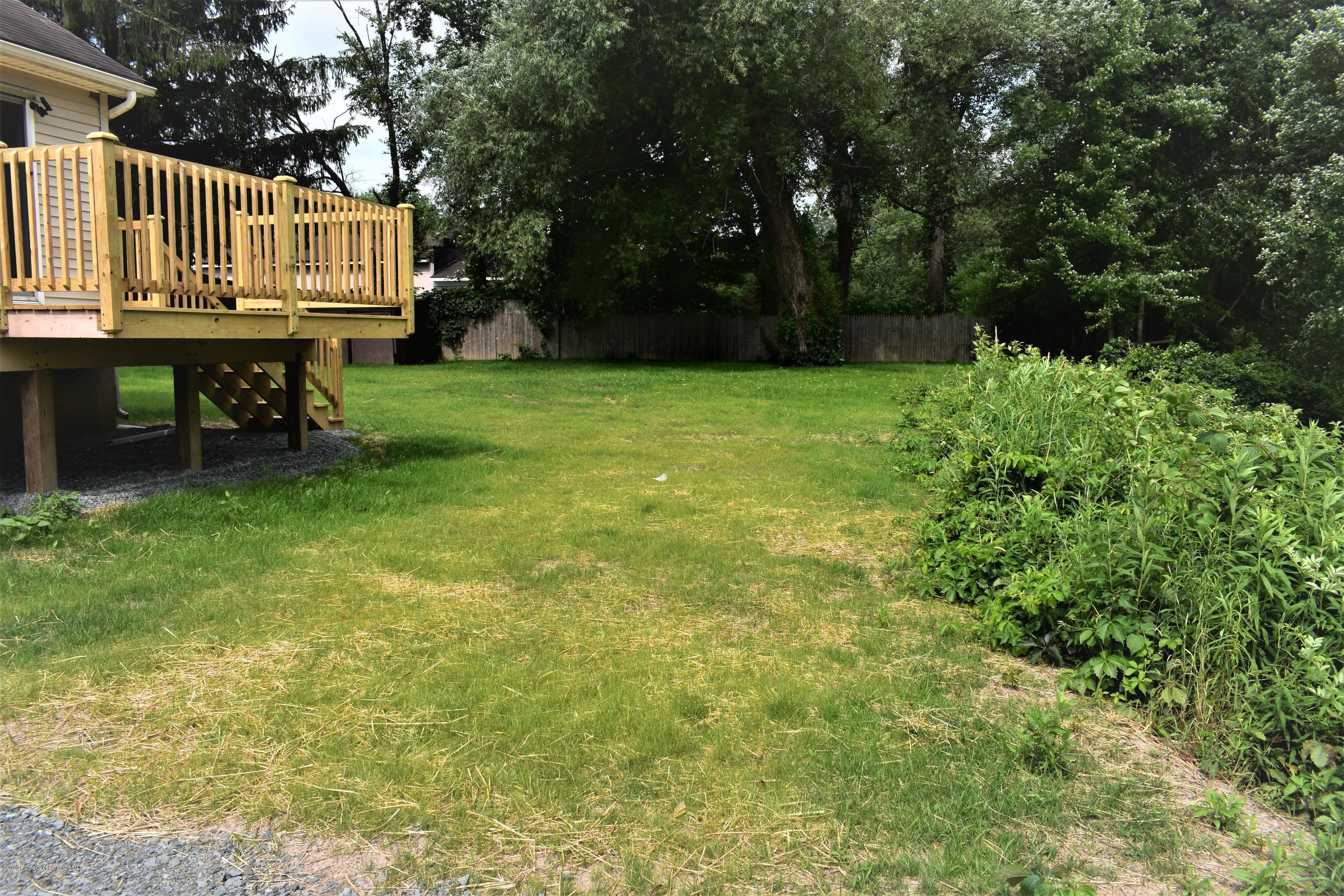 1597 Mt Cobb Road Lake Ariel, PA 18436 - Photo 22 of 28 a view of a backyard with a small cabin