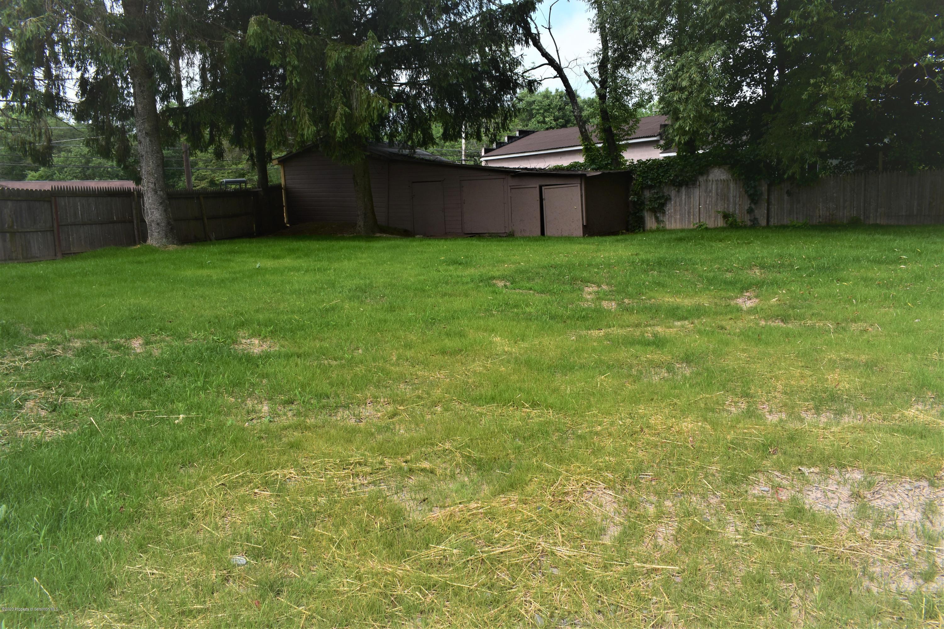1597 Mt Cobb Road Lake Ariel, PA 18436 - Photo 24 of 28 a view of a yard with a house and large trees