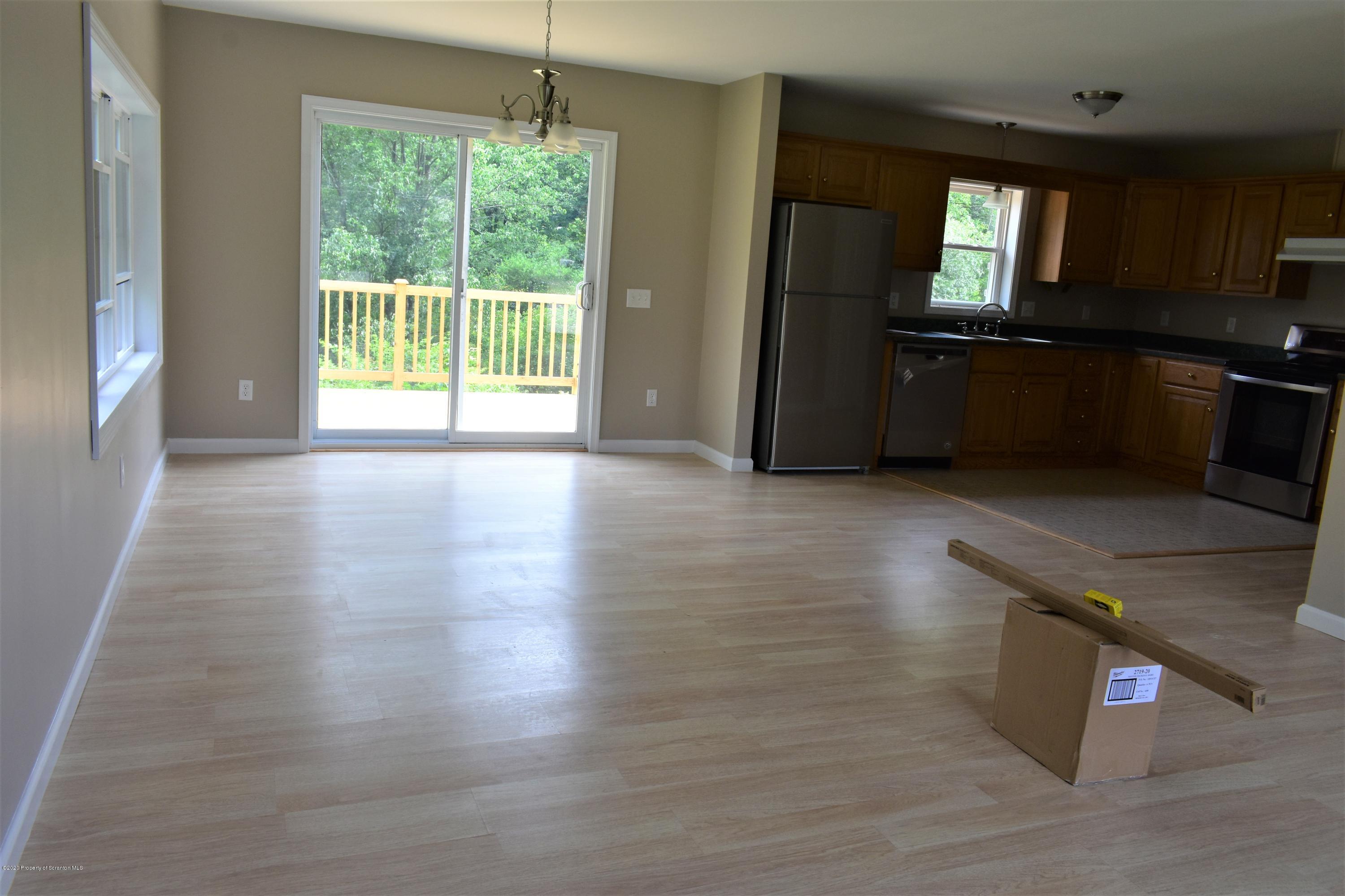1597 Mt Cobb Road Lake Ariel, PA 18436 - Photo 4 of 28 a view of a kitchen island wooden floor and a window