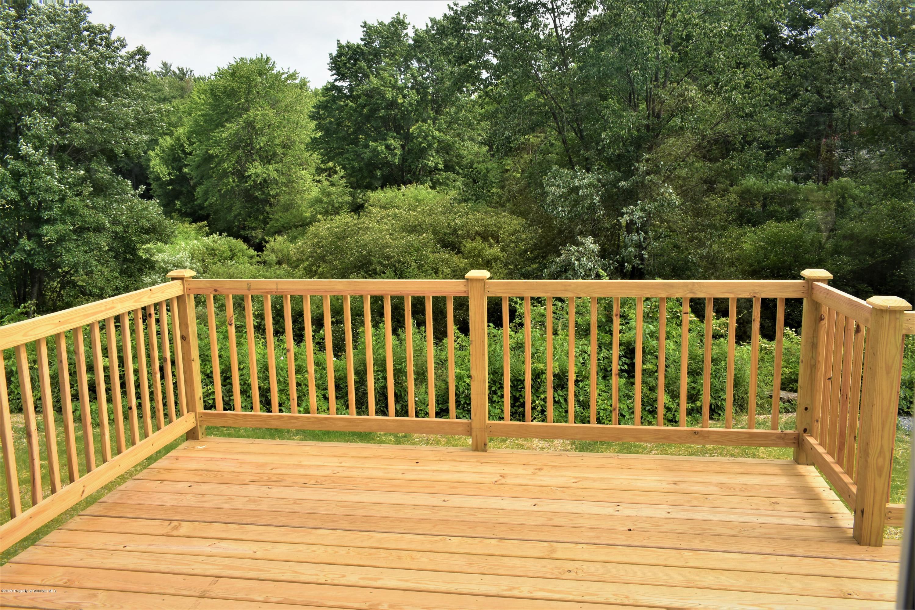 1597 Mt Cobb Road Lake Ariel, PA 18436 - Photo 5 of 28 a view of a wooden fence