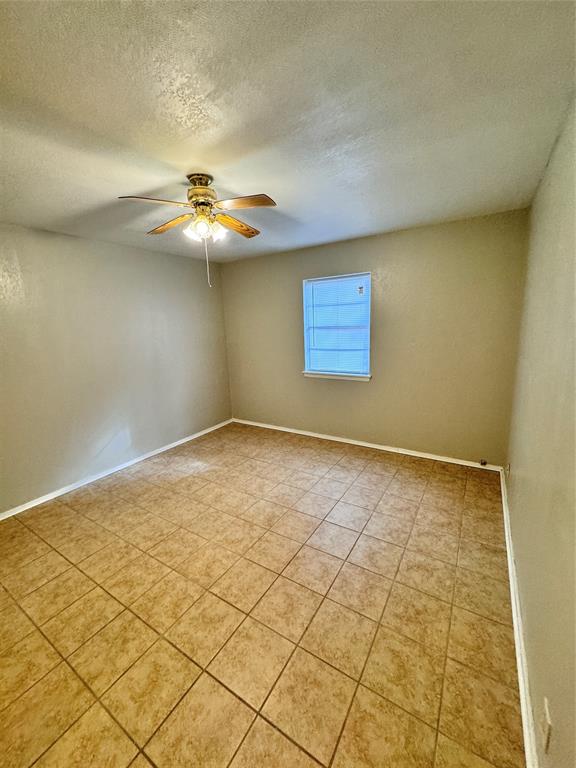 2703 Southside Drive Brownwood, TX 76801 - Photo 2 of 14 a view of an empty room and a window