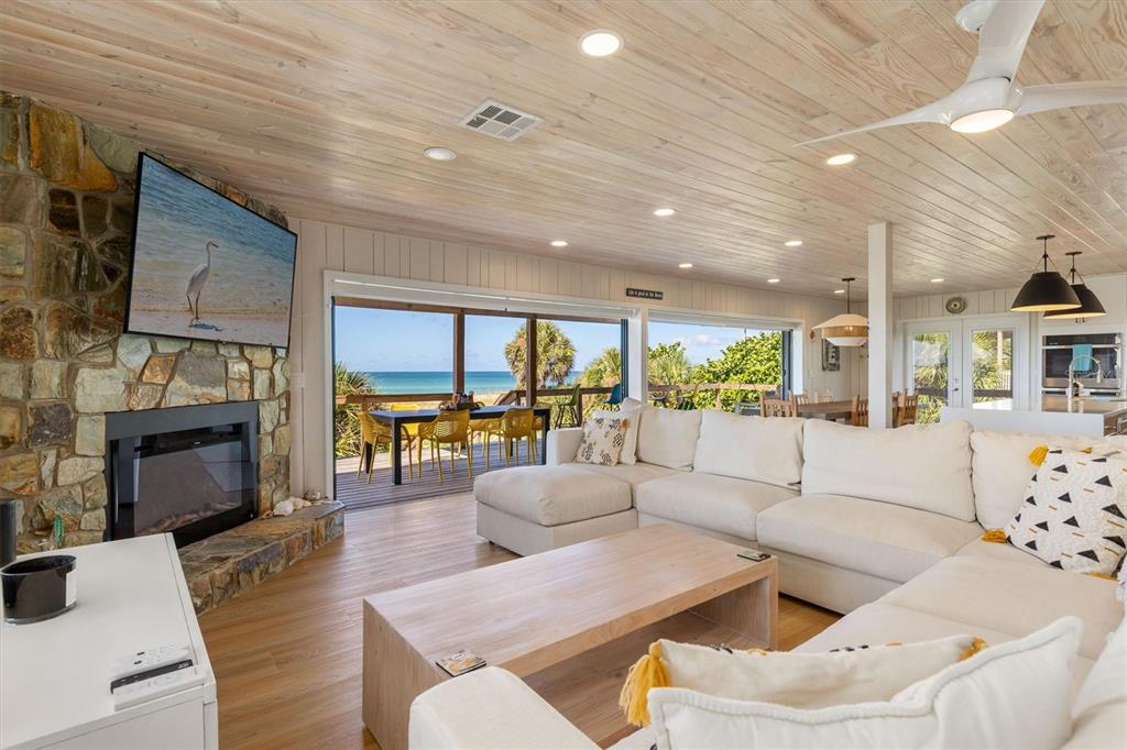 9498 Alborado Road Boca Grande, FL 33921 - Photo 15 of 81 a living room with fireplace furniture and a flat screen tv