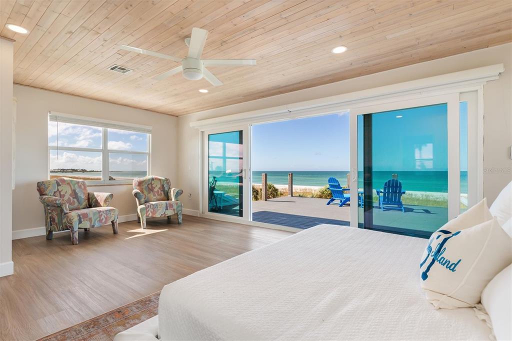 9498 Alborado Road Boca Grande, FL 33921 - Photo 23 of 81 a living room with furniture and a large window