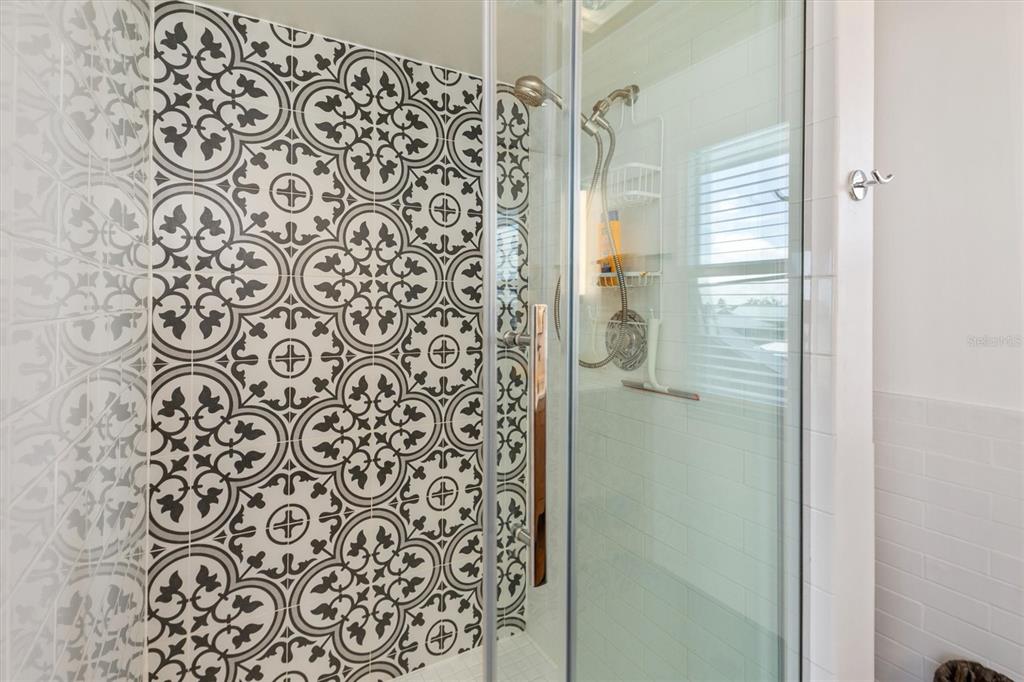 9498 Alborado Road Boca Grande, FL 33921 - Photo 30 of 81 a bathroom with a shower curtain