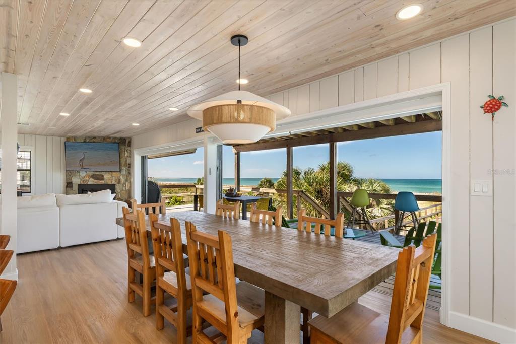 9498 Alborado Road Boca Grande, FL 33921 - Photo 3 of 81 a view of a dining room with furniture window and wooden floor