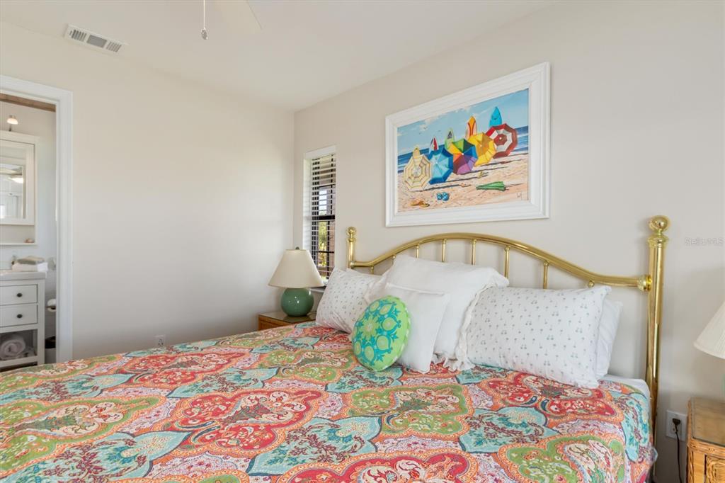 9498 Alborado Road Boca Grande, FL 33921 - Photo 33 of 81 a bedroom with a bed and a painting on the wall