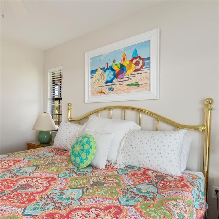 9498 Alborado Road Boca Grande, FL 33921 - Photo 34 of 81 a bedroom with a bed and a painting on the wall