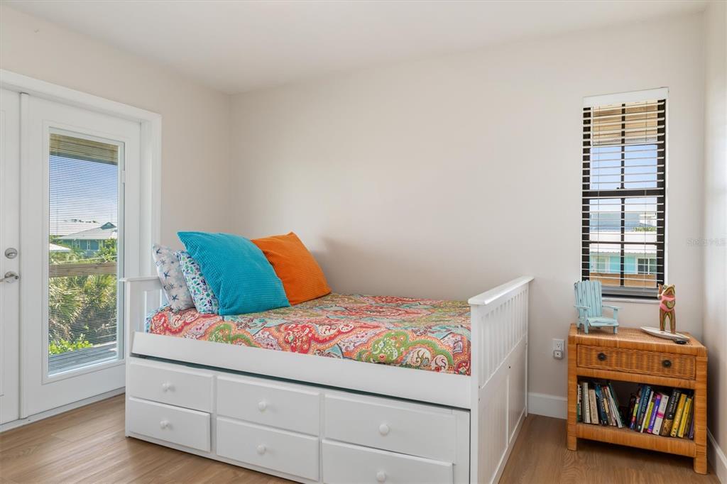 9498 Alborado Road Boca Grande, FL 33921 - Photo 38 of 81 a bedroom with a bed and a window