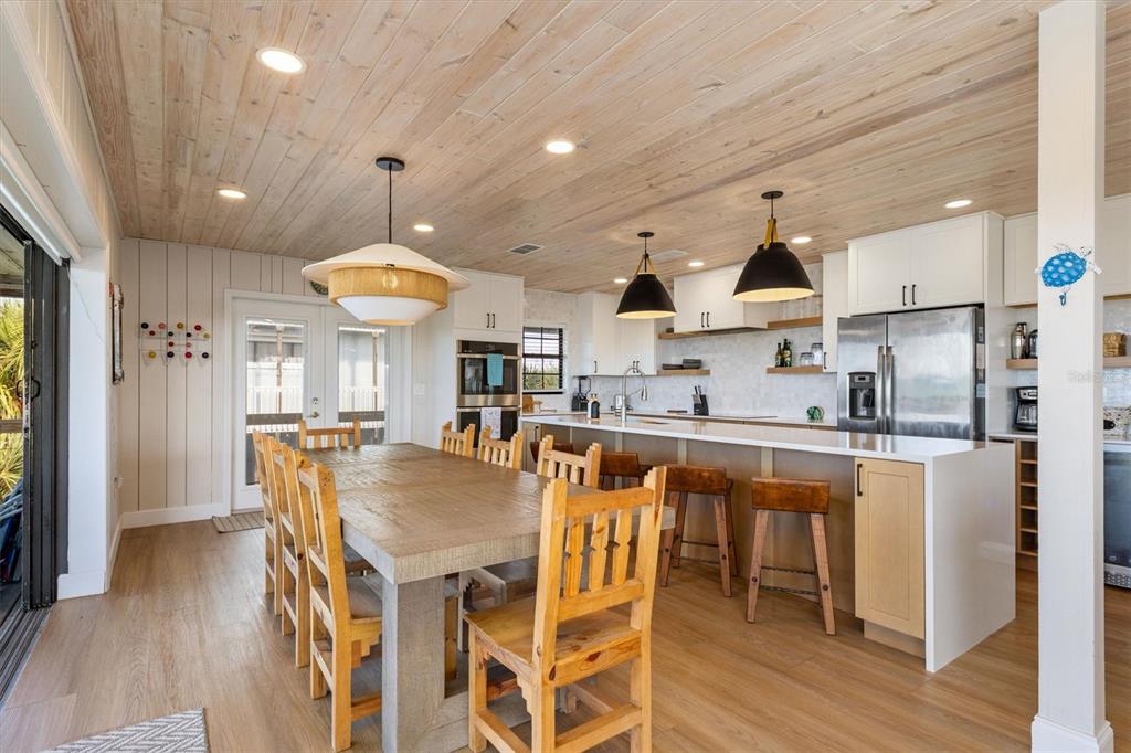 9498 Alborado Road Boca Grande, FL 33921 - Photo 4 of 81 a kitchen with stainless steel appliances granite countertop a sink a stove and a refrigerator