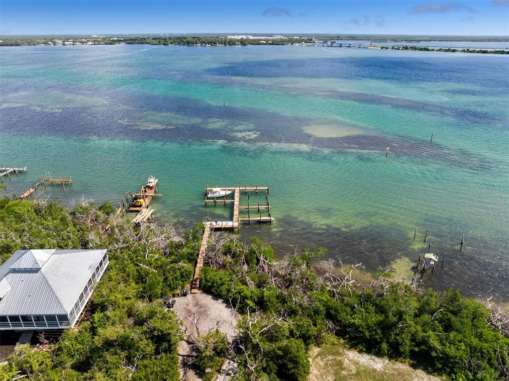 9498 Alborado Road Boca Grande, FL 33921 - Photo 80 of 81 an aerial view of a house with a yard