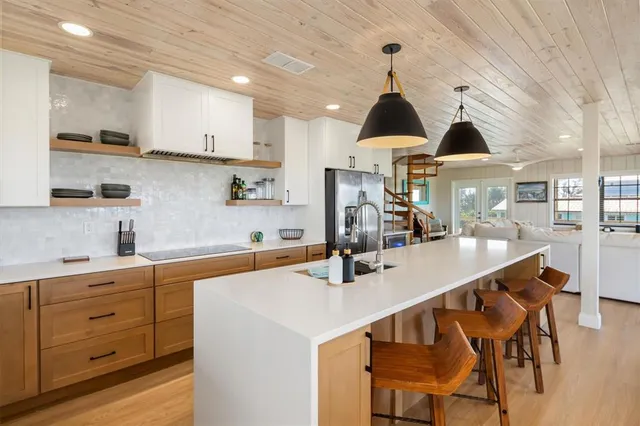 a kitchen that has a sink and a stove