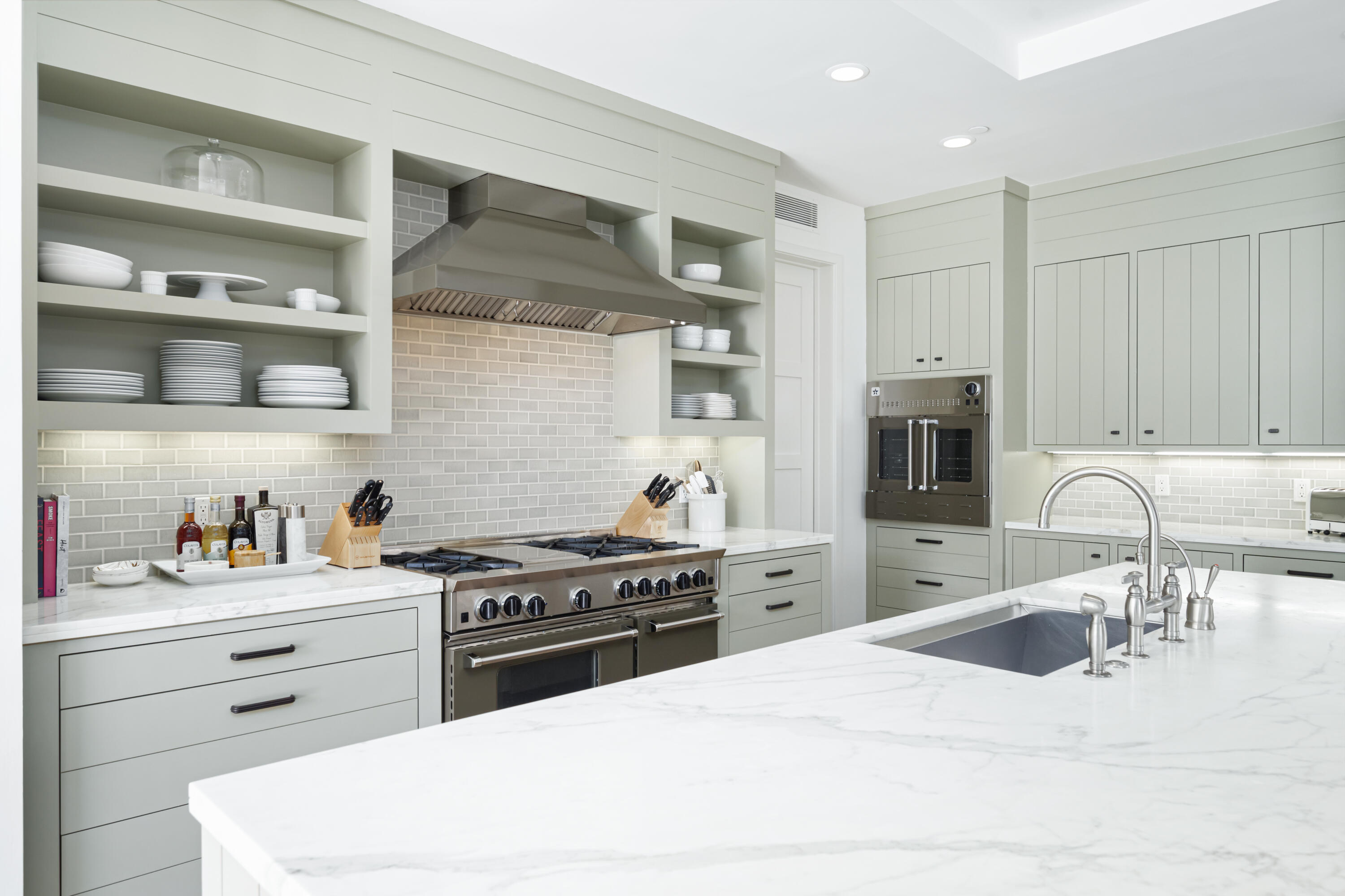 53615 Via Strada La Quinta, CA 92253 - Photo 15 of 52 a kitchen with granite countertop a sink a stove and wooden cabinets