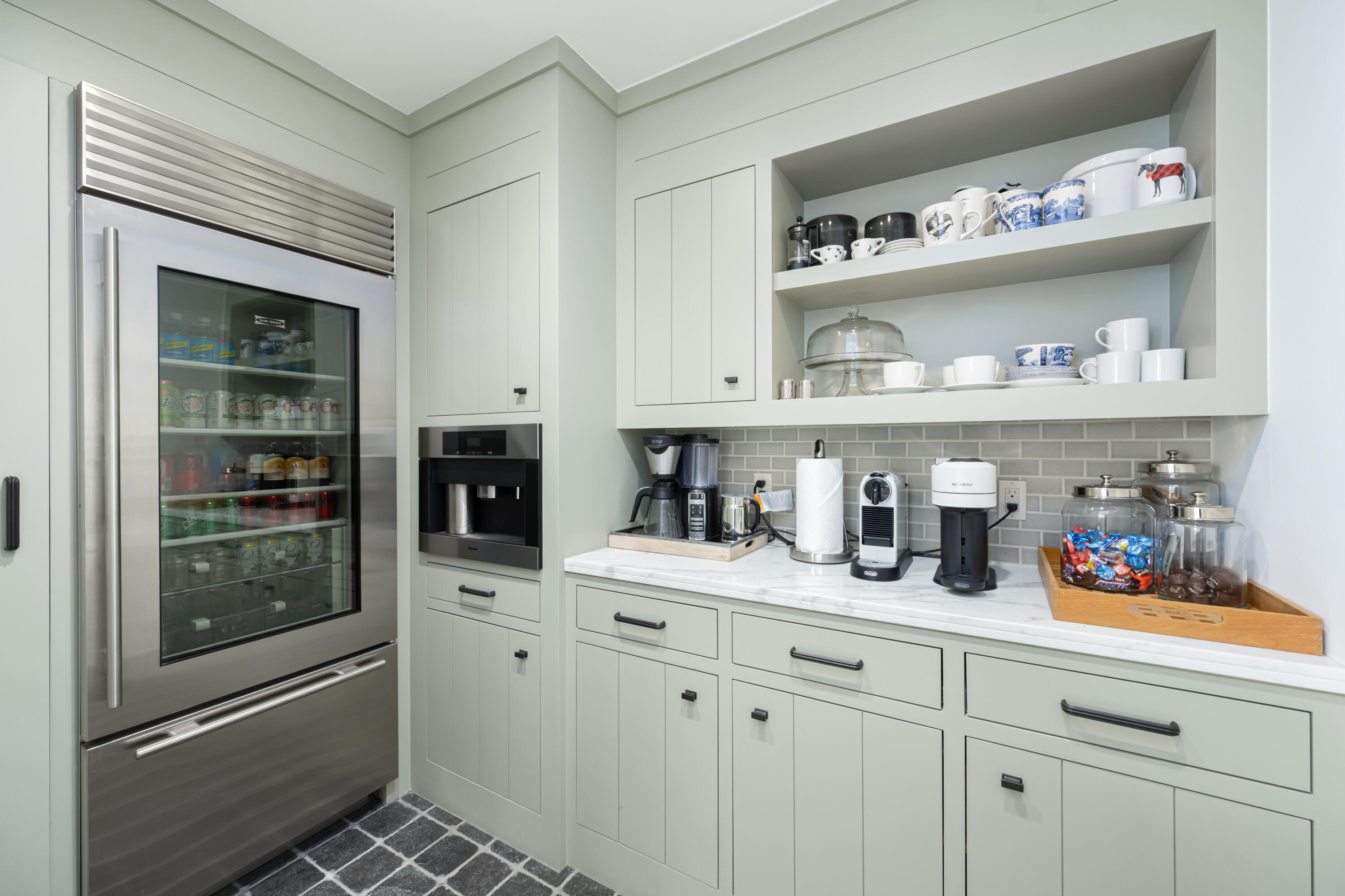 53615 Via Strada La Quinta, CA 92253 - Photo 16 of 52 a kitchen with white cabinets and a refrigerator