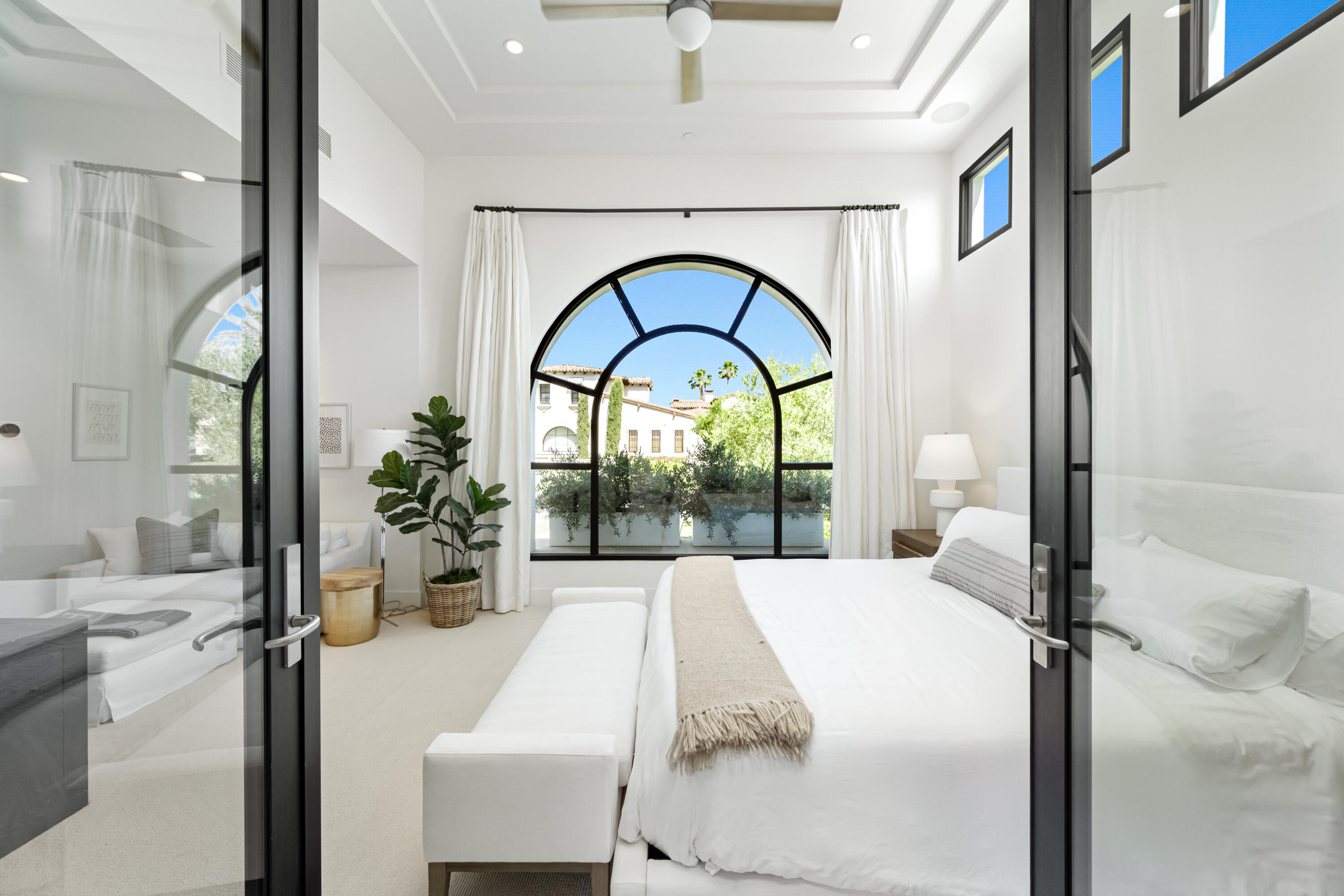 53615 Via Strada La Quinta, CA 92253 - Photo 25 of 52 a bedroom with a bed and a large mirror