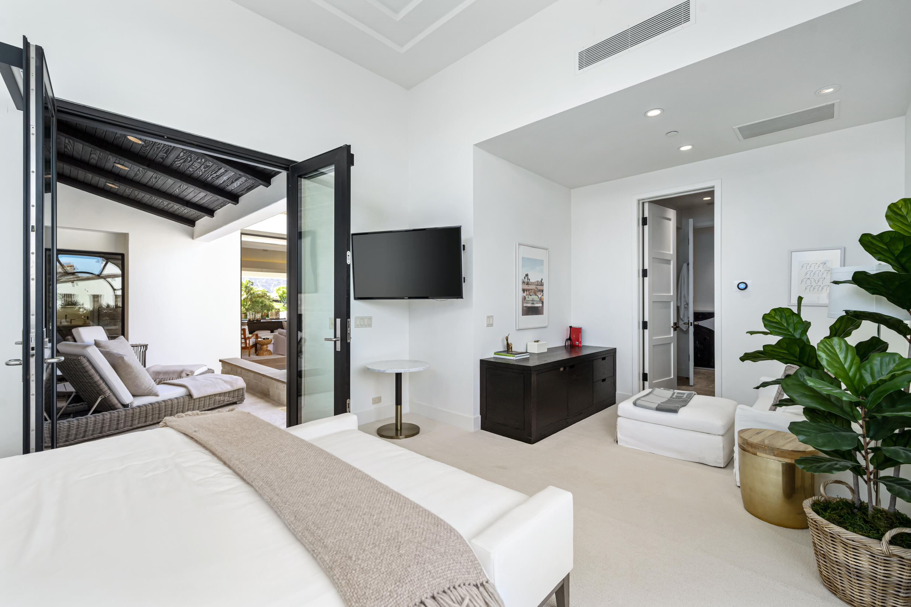 53615 Via Strada La Quinta, CA 92253 - Photo 26 of 52 a living room with furniture and a flat screen tv
