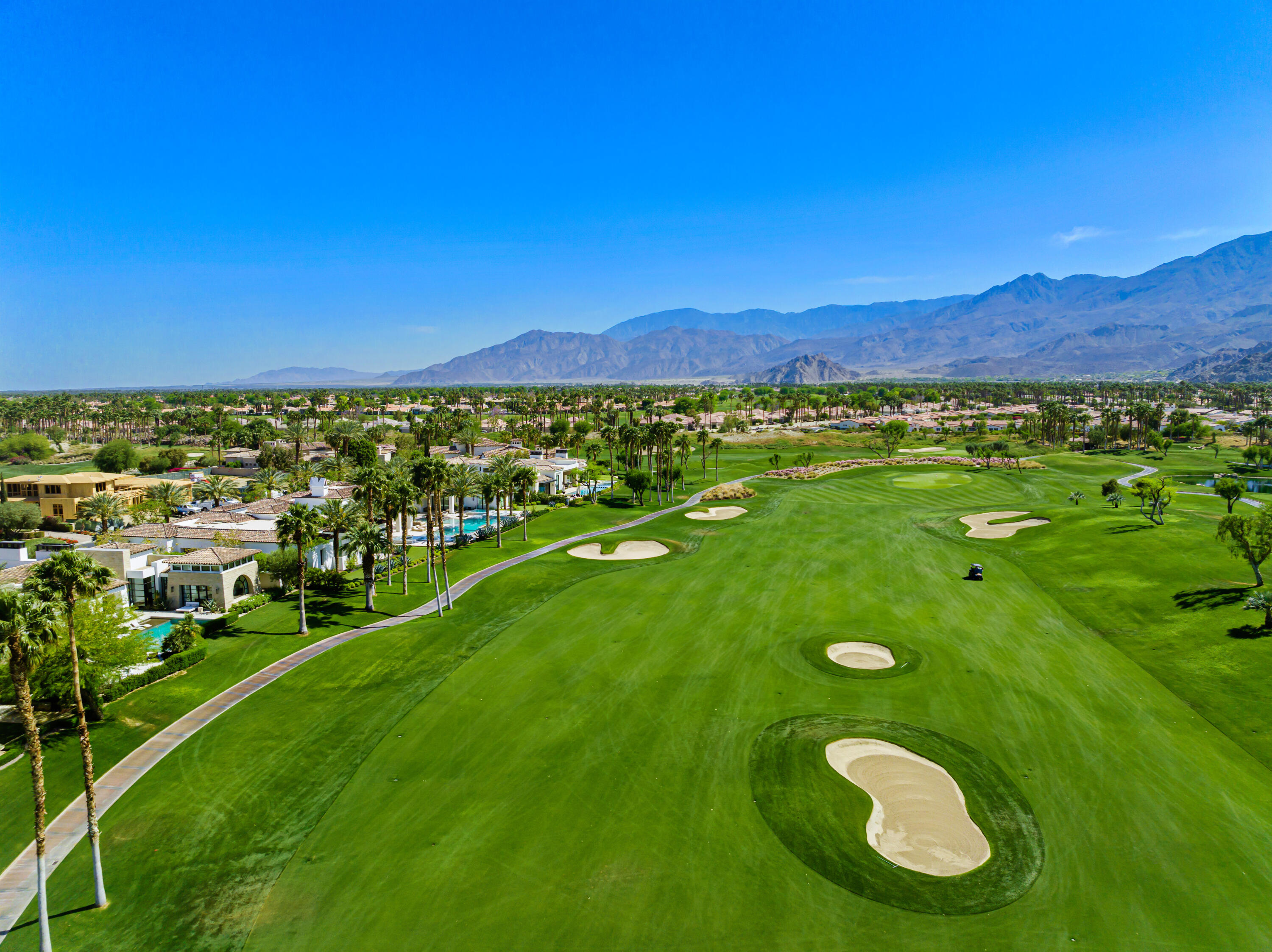53615 Via Strada La Quinta, CA 92253 - Photo 3 of 52 a view of a golf course with chairs