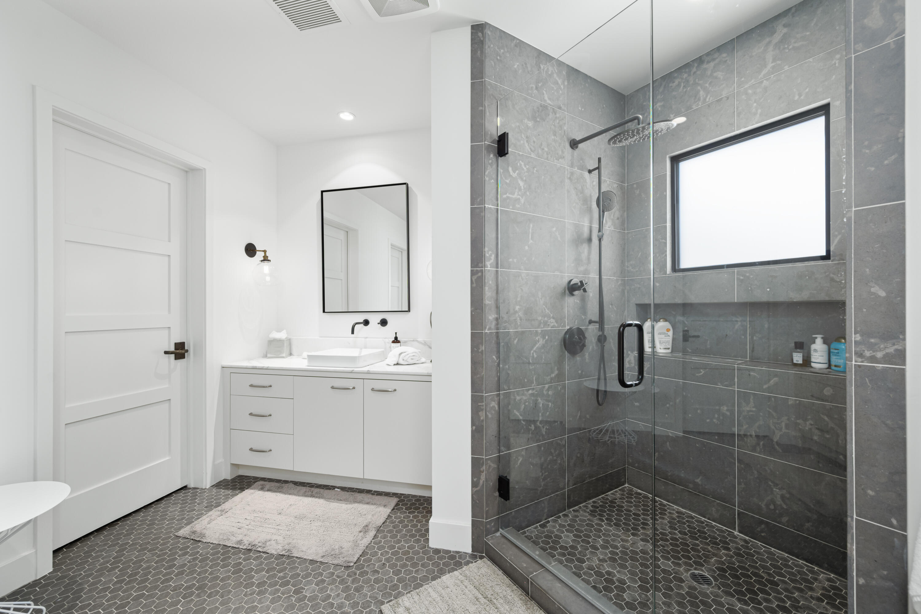 53615 Via Strada La Quinta, CA 92253 - Photo 34 of 52 a spacious bathroom with a shower sink and mirror