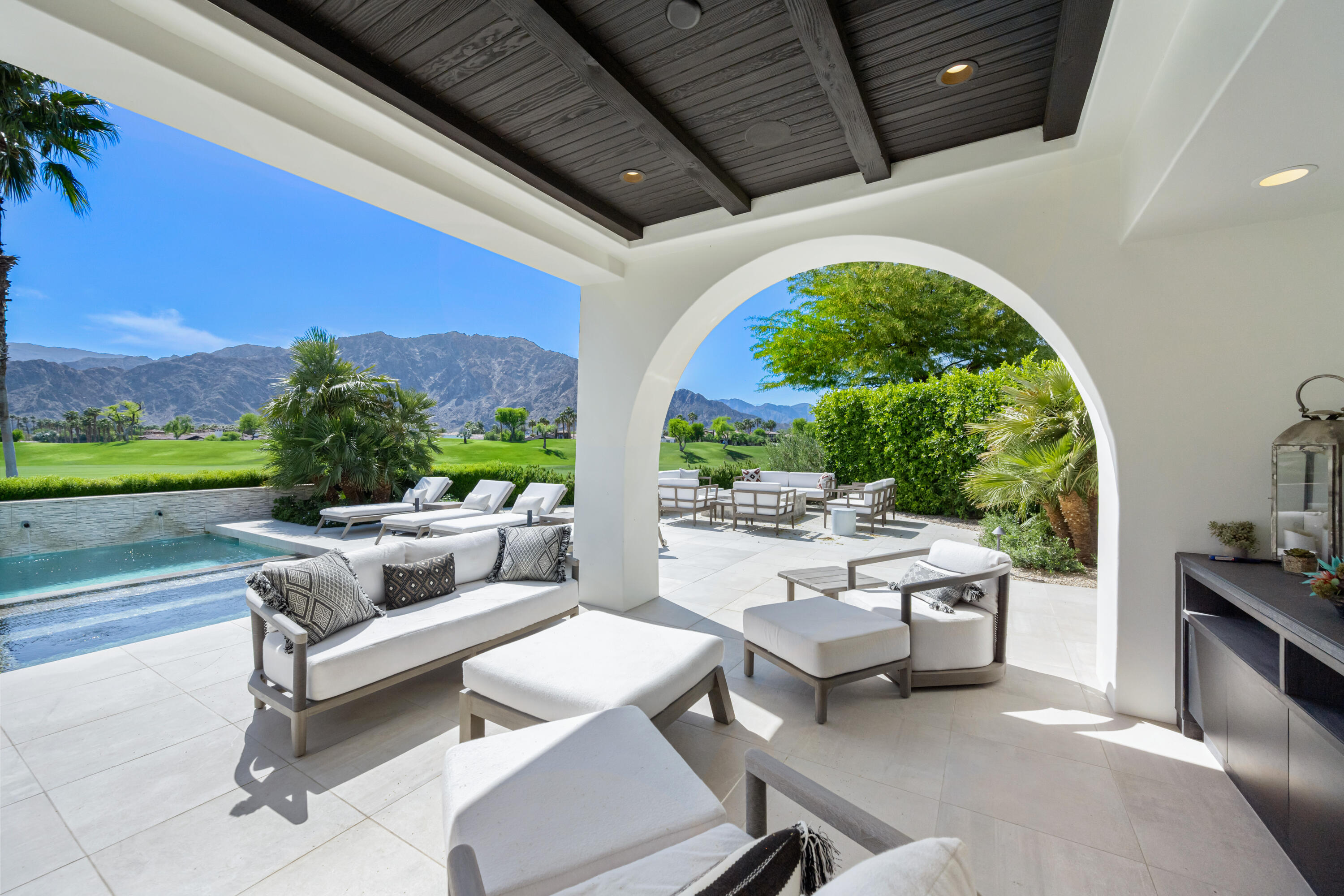 53615 Via Strada La Quinta, CA 92253 - Photo 41 of 52 a outdoor space with couches and a potted plant