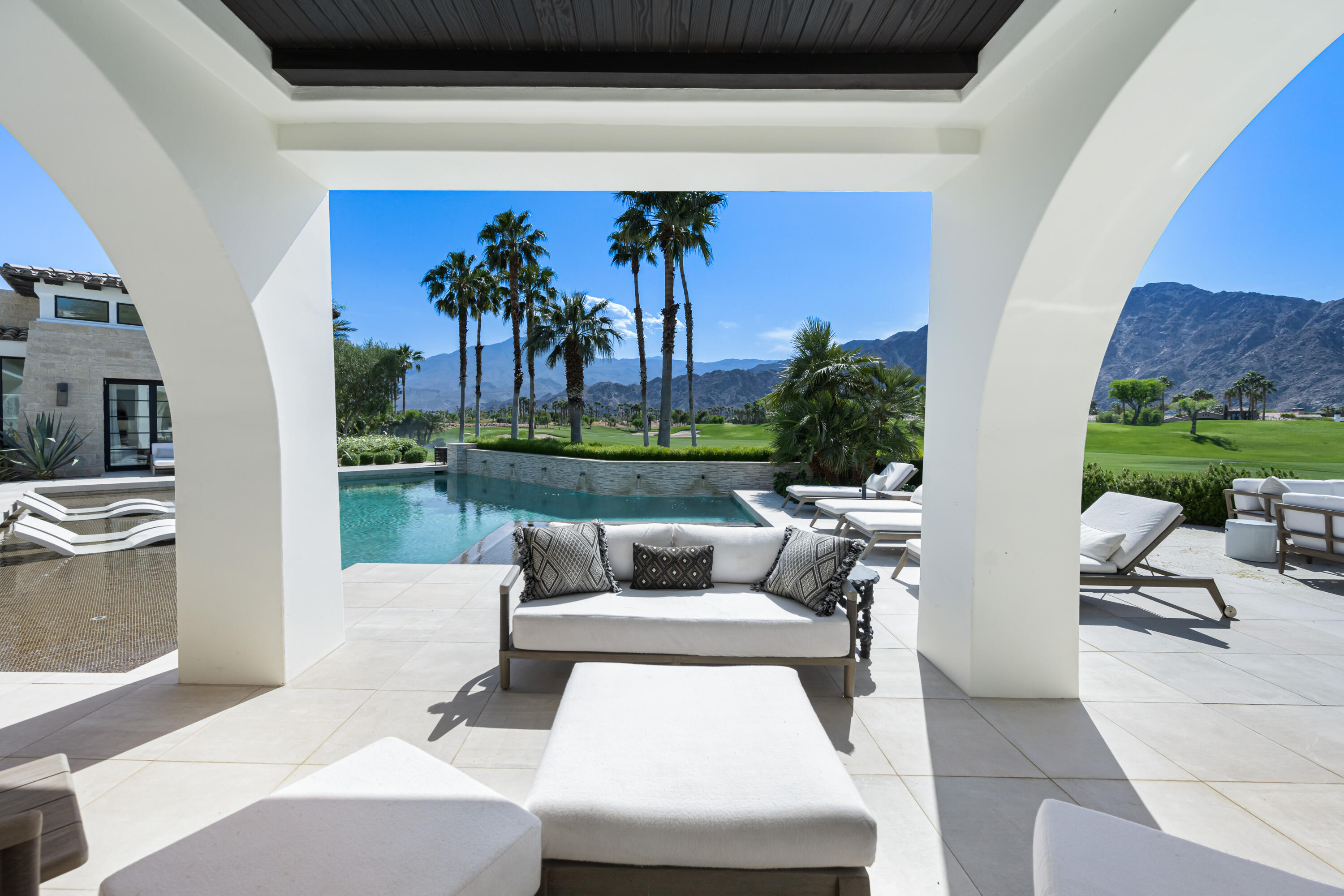 53615 Via Strada La Quinta, CA 92253 - Photo 42 of 52 a living room with furniture and a yard