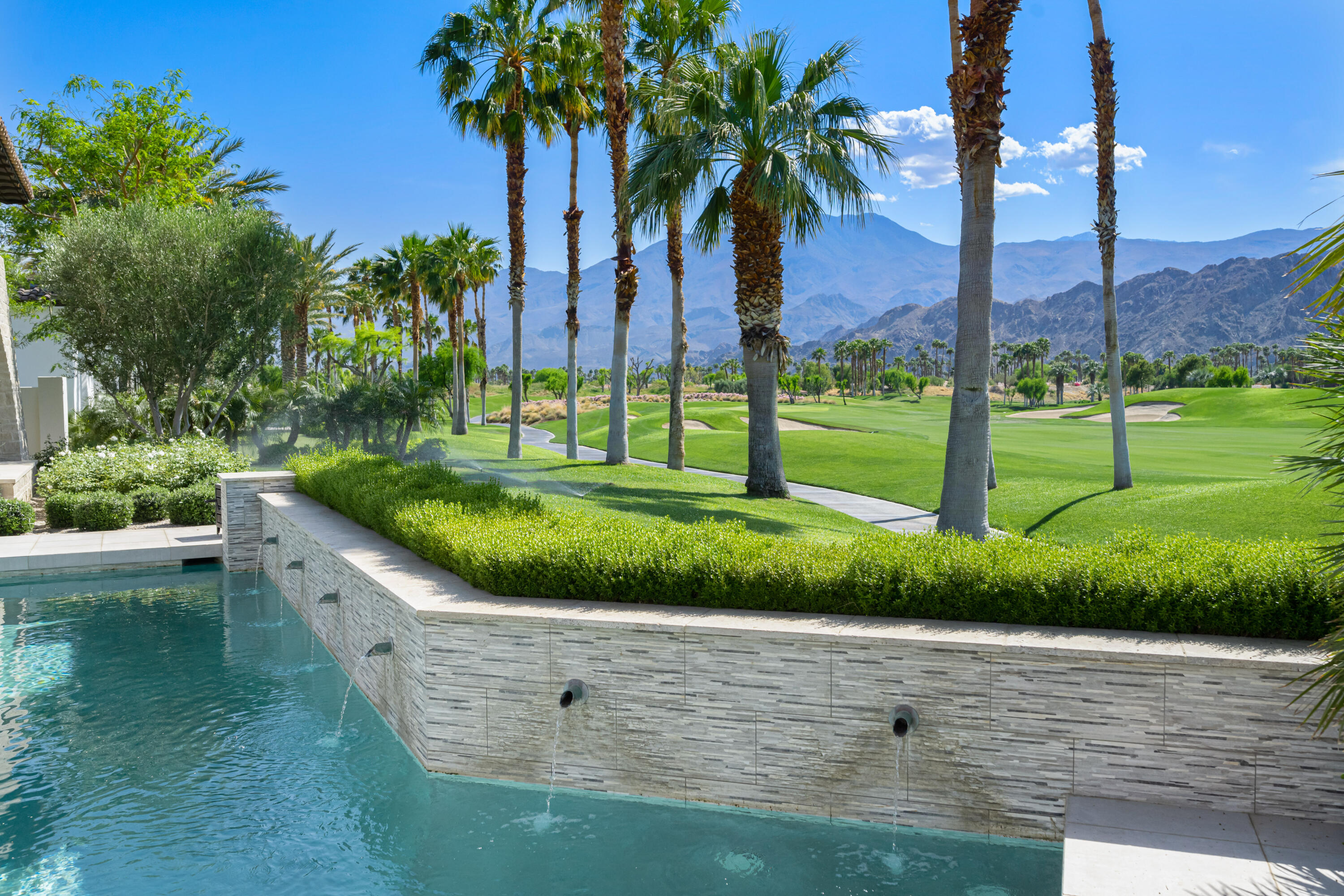 53615 Via Strada La Quinta, CA 92253 - Photo 52 of 52 a view of a lake with a yard and palm trees