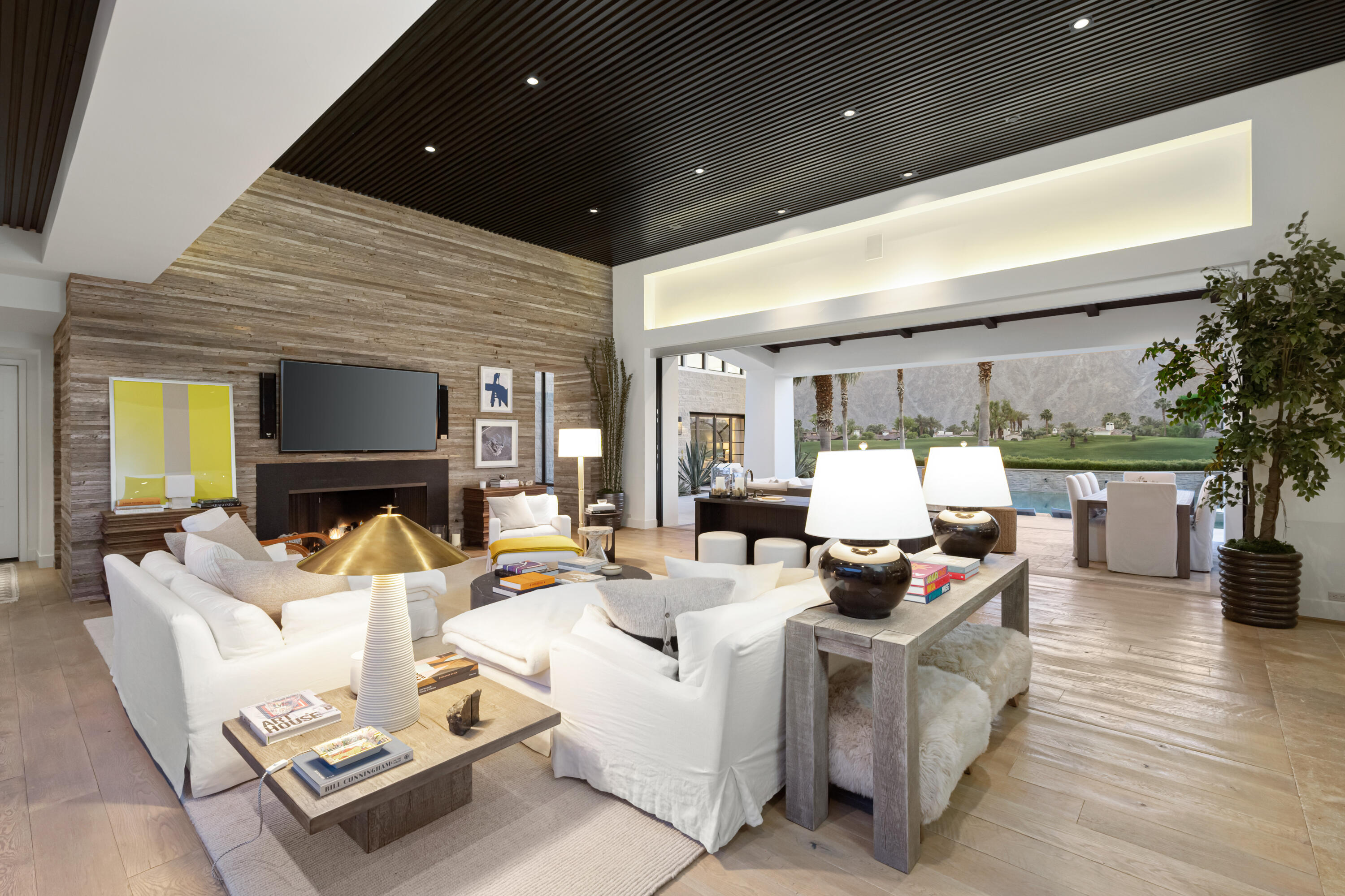 53615 Via Strada La Quinta, CA 92253 - Photo 9 of 52 a living room with furniture a fireplace and a potted plant