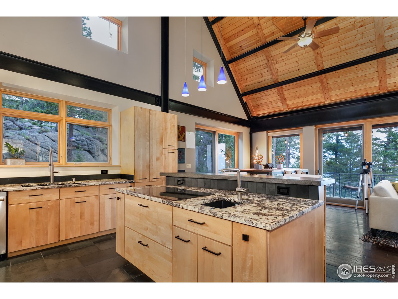 116 Ramona Road Golden, CO 80403 - Photo 11 of 40 a kitchen with a stove and white cabinets