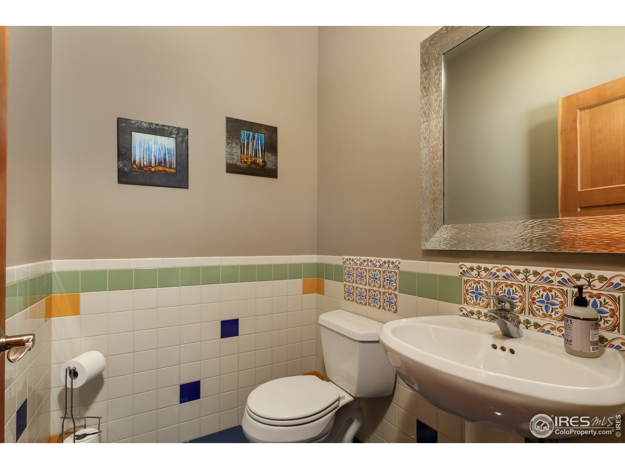 116 Ramona Road Golden, CO 80403 - Photo 23 of 40 a bathroom with a sink a toilet and mirror
