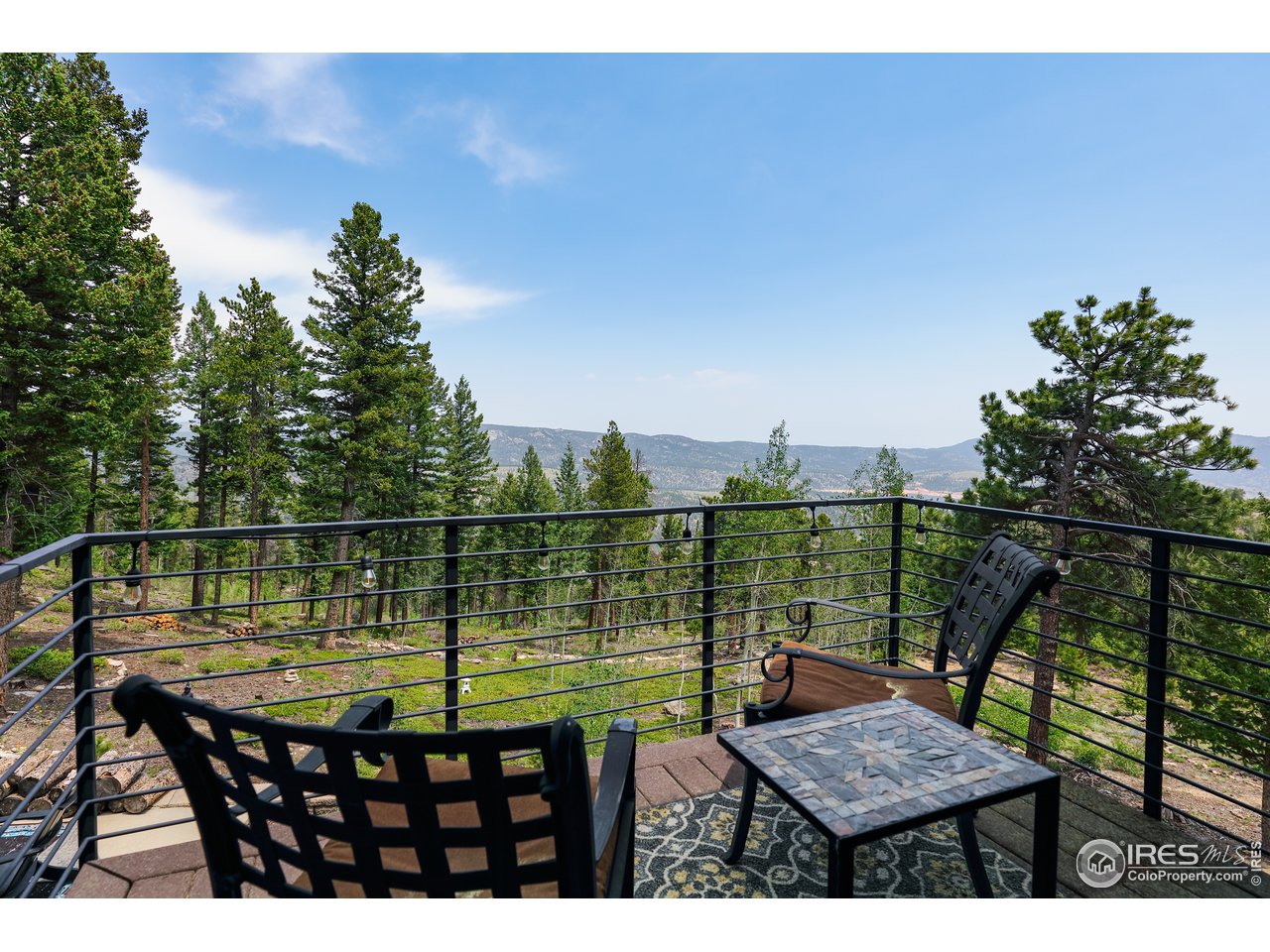 116 Ramona Road Golden, CO 80403 - Photo 29 of 40 a view of a balcony with lake view and a floor to ceiling window next to a lake view
