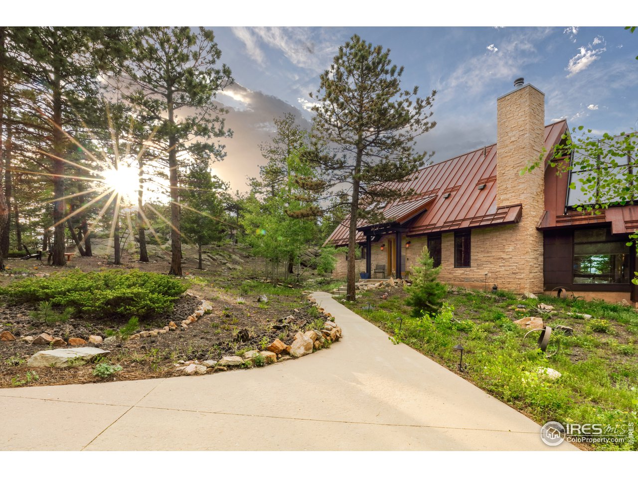 116 Ramona Road Golden, CO 80403 - Photo 3 of 40 a front view of a house with garden