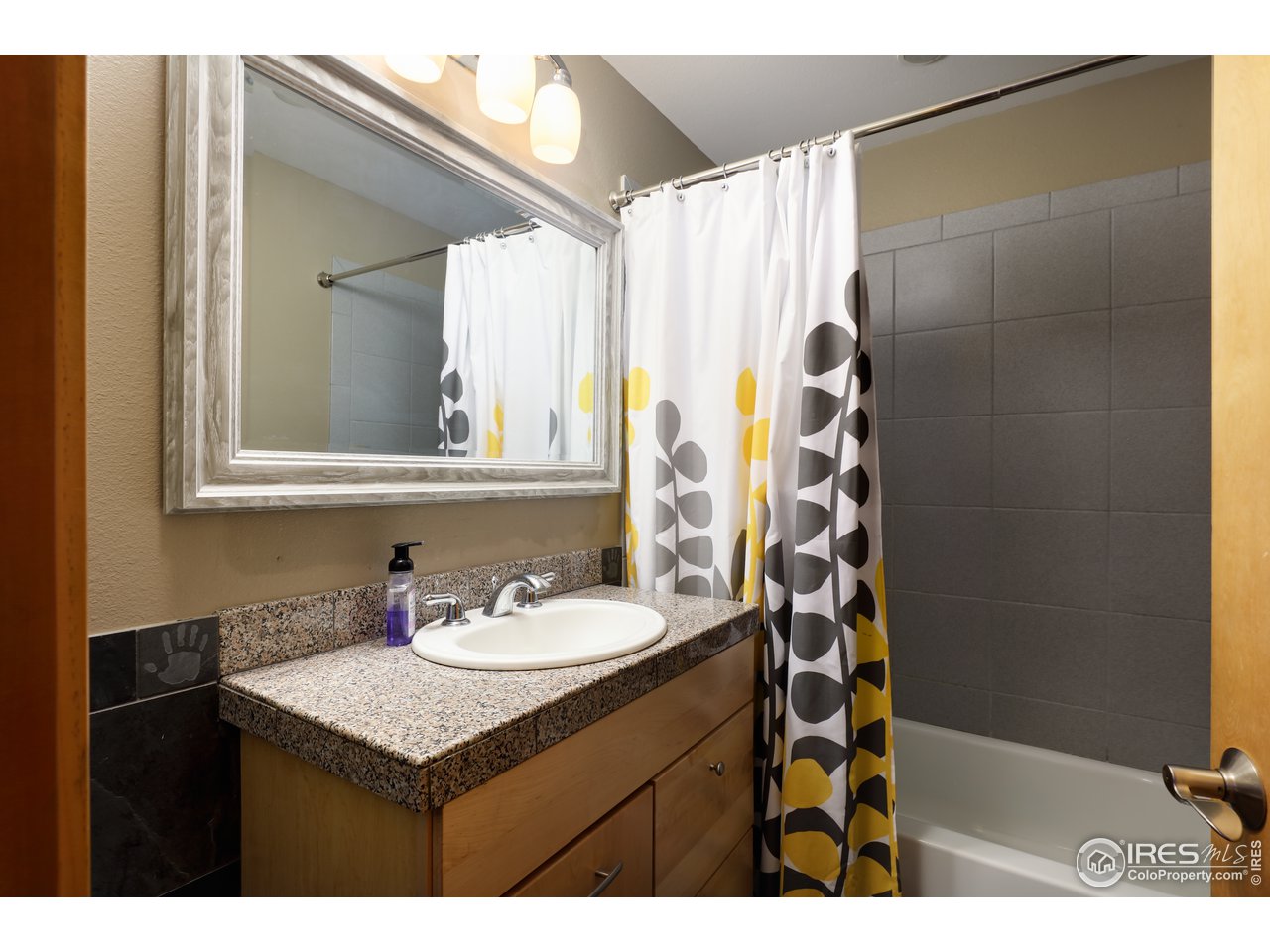 116 Ramona Road Golden, CO 80403 - Photo 36 of 40 a bathroom with a sink and a mirror