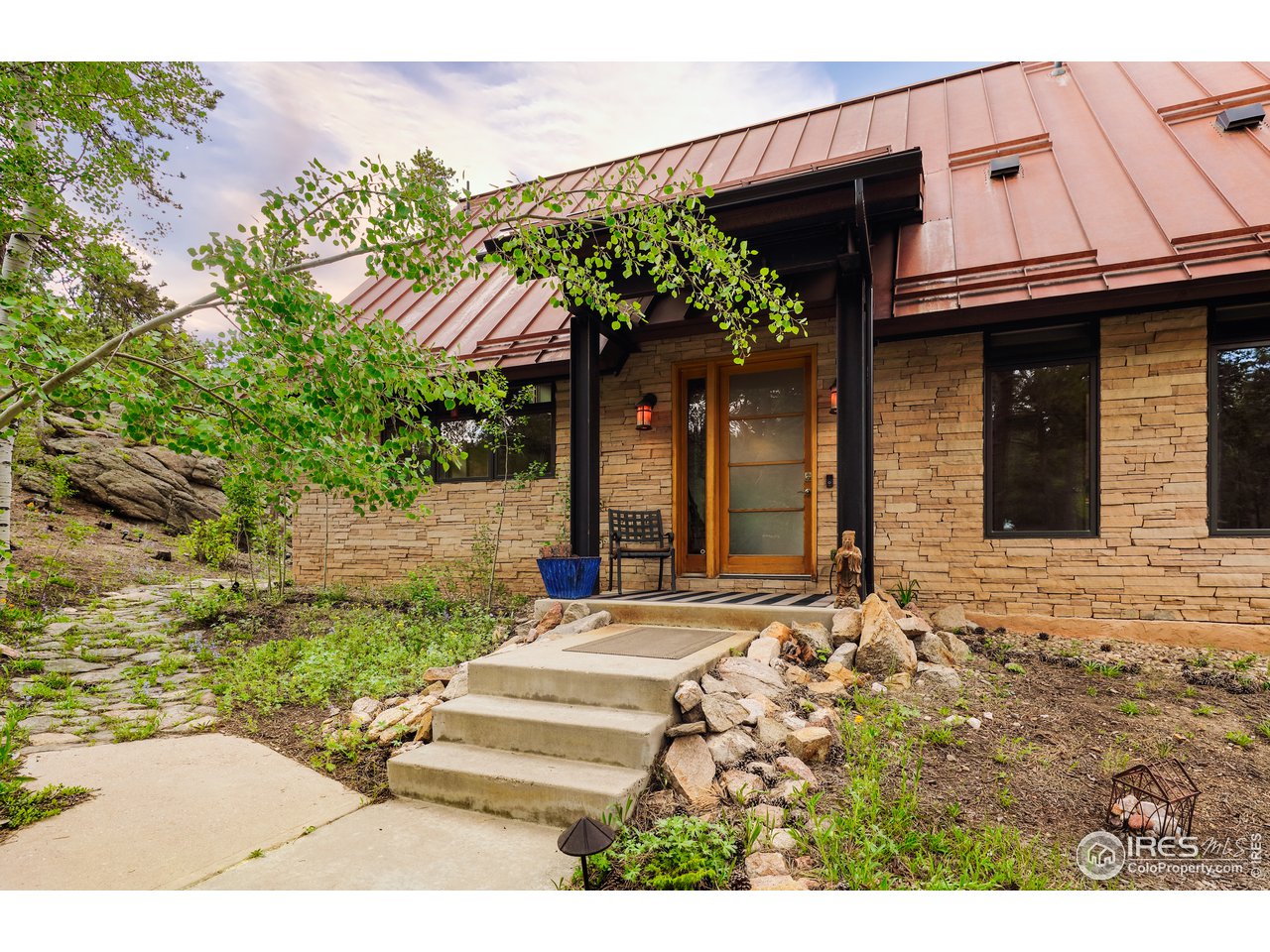 116 Ramona Road Golden, CO 80403 - Photo 4 of 40 a view of a house with potted plants