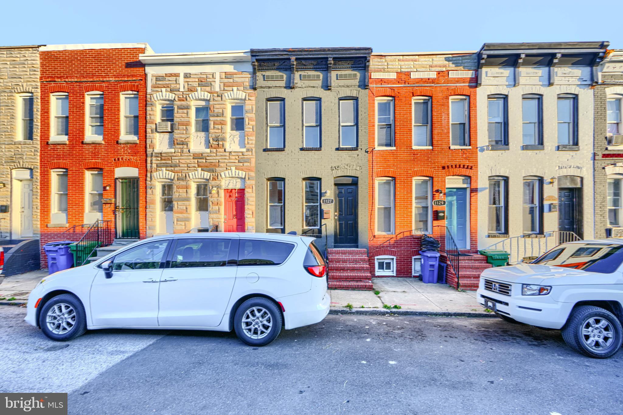 1127 Sargeant Street Baltimore, MD 21223 - Photo 3 of 34 a car parked in front of a house