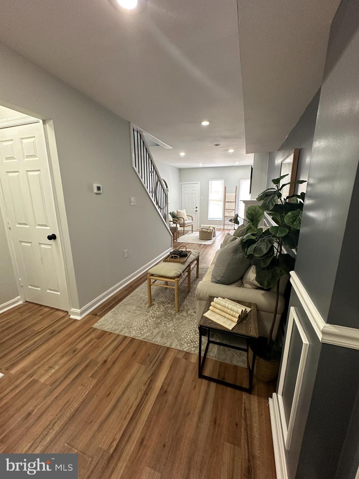 1127 Sargeant Street Baltimore, MD 21223 - Photo 10 of 34 a living room with furniture and wooden floor