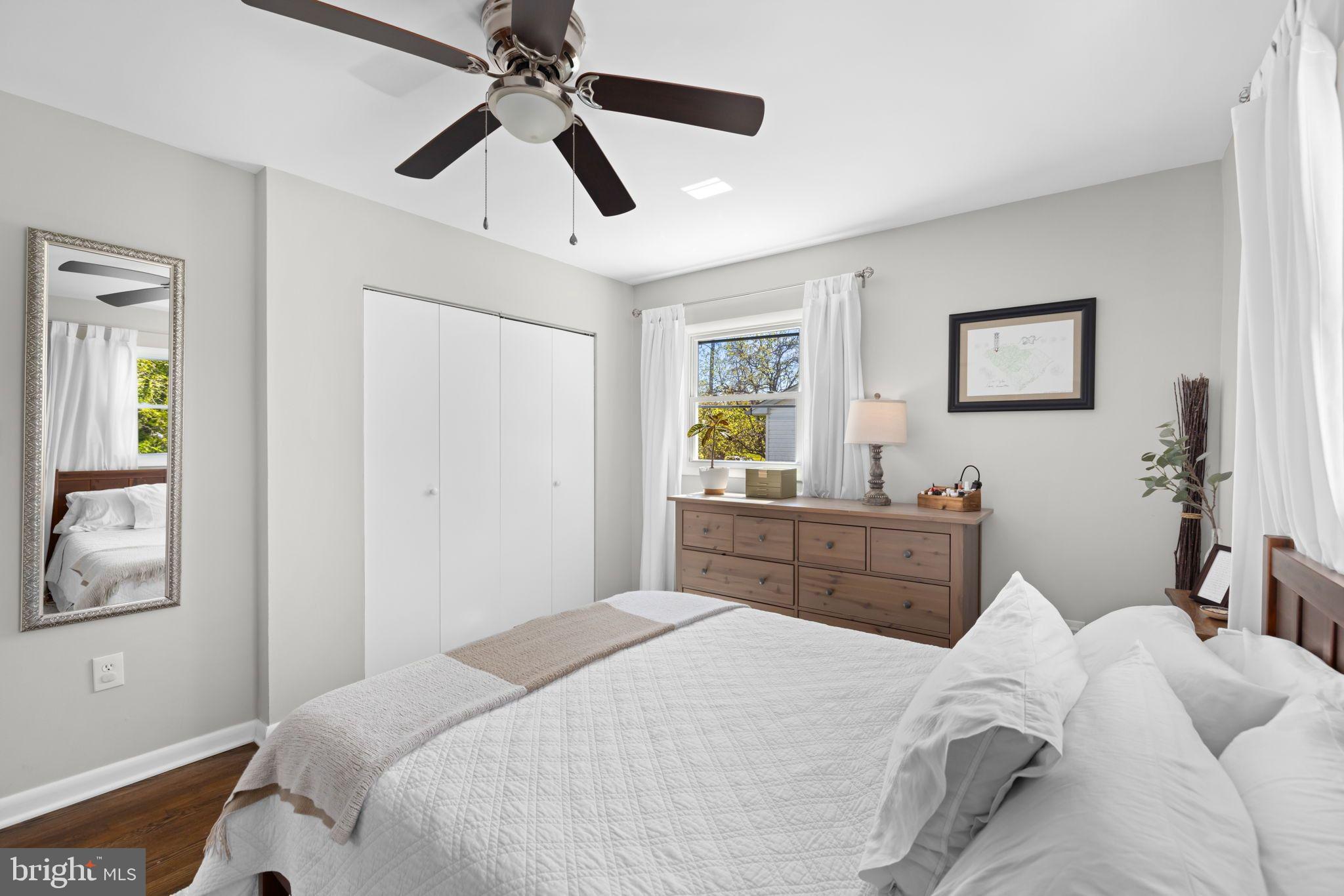 6502 Haystack Road Alexandria, VA 22310 - Photo 13 of 30 a bedroom with a bed and a chandelier