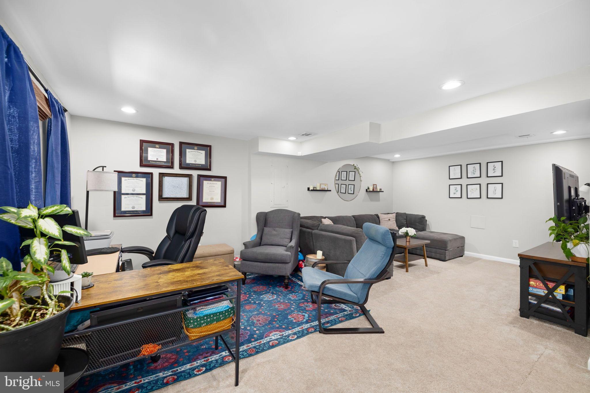 6502 Haystack Road Alexandria, VA 22310 - Photo 17 of 30 a living room with furniture and a bookshelf