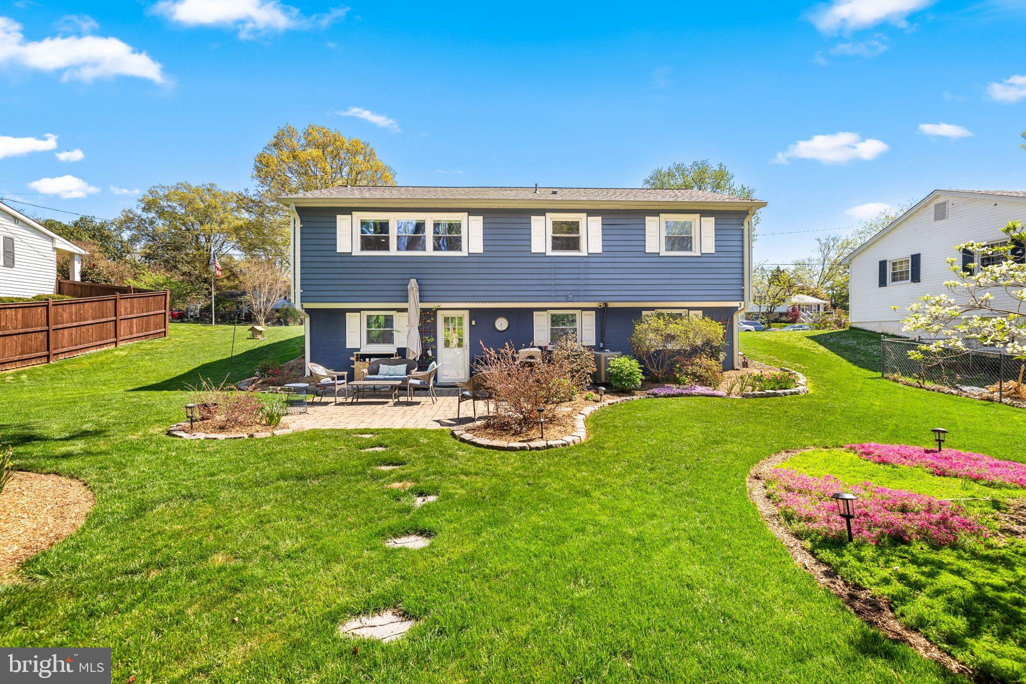 6502 Haystack Road Alexandria, VA 22310 - Photo 23 of 30 a view of a house with backyard sitting area and garden