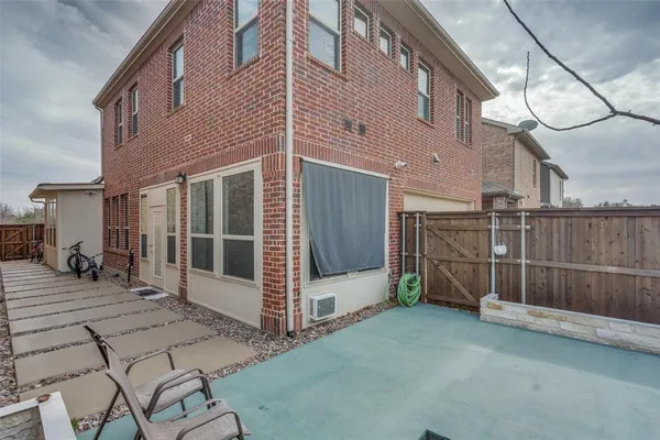 a view of a street with wooden fence