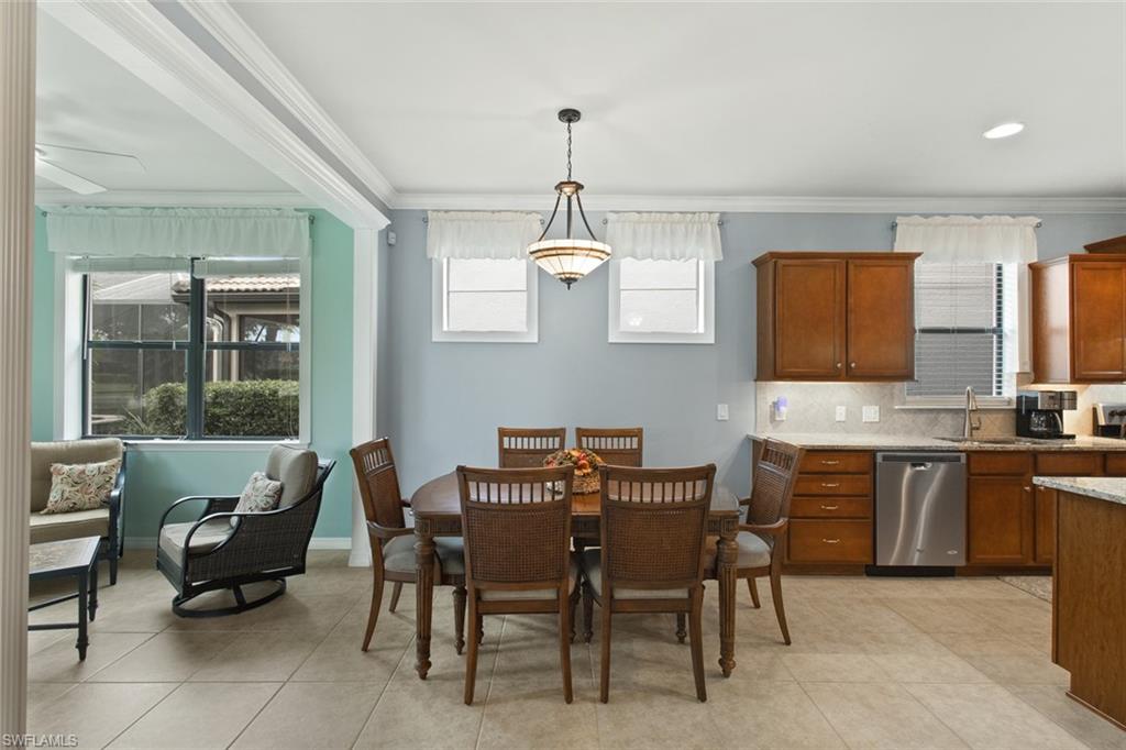 6085 Triumph Lane Ave Maria, FL 34142 - Photo 11 of 42 a dining room with furniture and window
