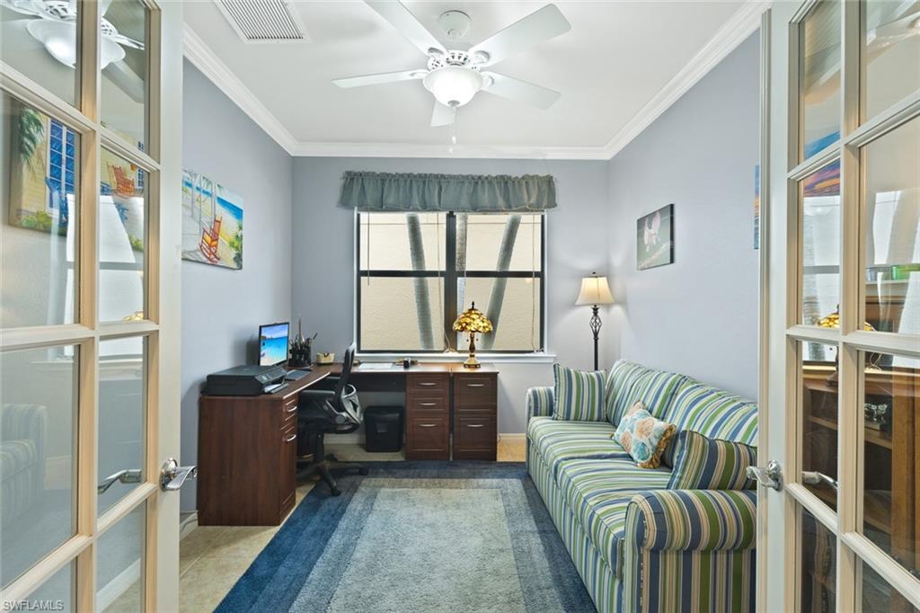 6085 Triumph Lane Ave Maria, FL 34142 - Photo 17 of 42 a living room with furniture and a window