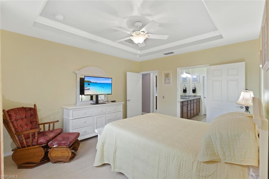 6085 Triumph Lane Ave Maria, FL 34142 - Photo 19 of 42 a bedroom with a bed and furniture