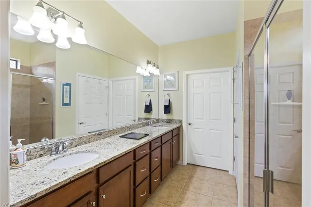 a bathroom with a sink vanity and a mirror