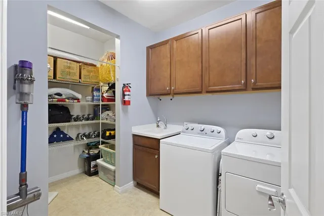 a view of storage and utility room with washer and dryer