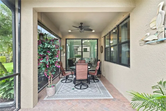a living room with a large window and a table