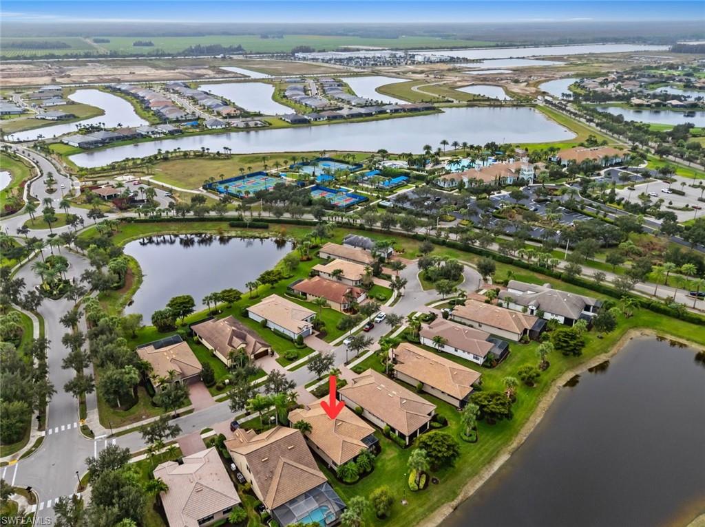 6085 Triumph Lane Ave Maria, FL 34142 - Photo 28 of 42 an aerial view of residential building and lake